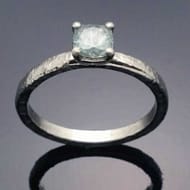 R556 Malleus teal sapphire center stone in Palladium ring